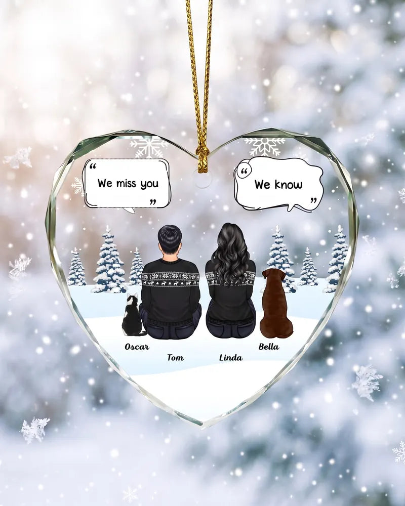 The glass heart ornament by a snowy window, showing Tom and Linda with their pets Oscar and Bella